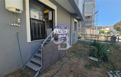 DİKİLİ ÇANDARLI MERKEZDE 1+1 EŞYALI BAHÇELİ SATILIK DAİRE