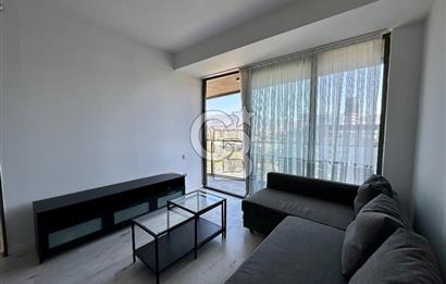 Ontan Bayraklı'da Kiralık Eşyalı Cadde Cepheli Ferah 1+1 Daire