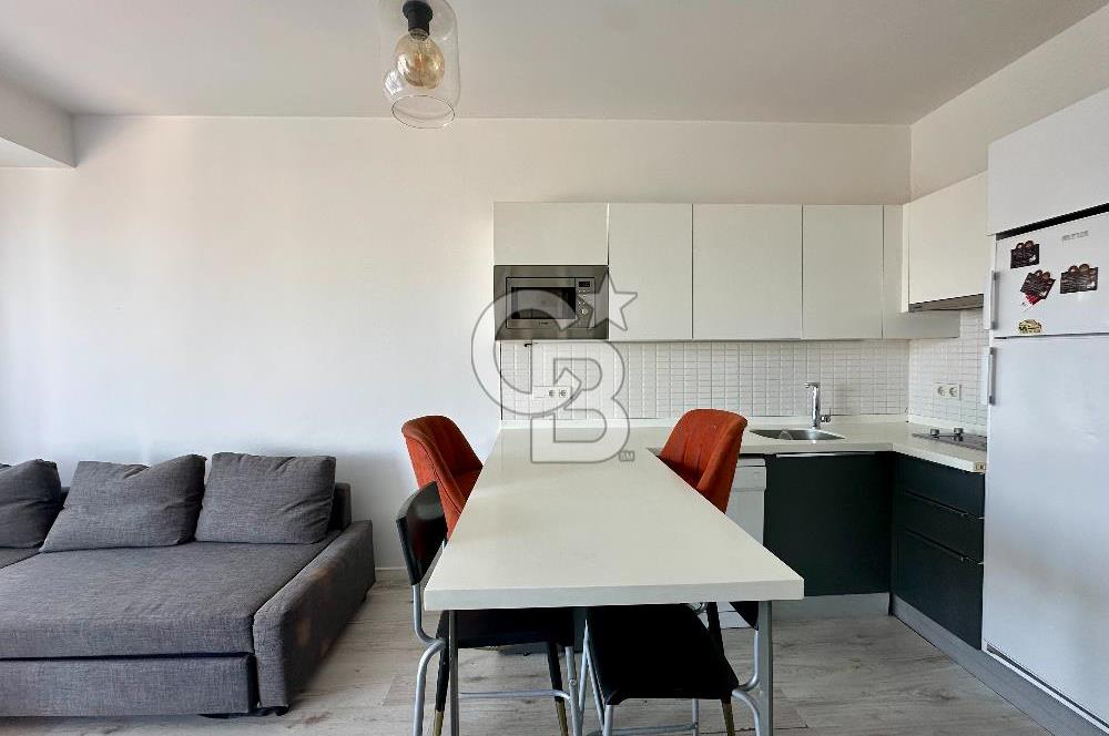 Ontan Bayraklı'da Kiralık Eşyalı Cadde Cepheli Ferah 1+1 Daire