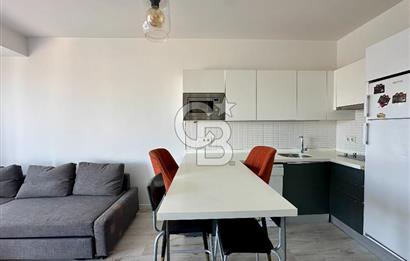 Ontan Bayraklı'da Kiralık Eşyalı Cadde Cepheli Ferah 1+1 Daire