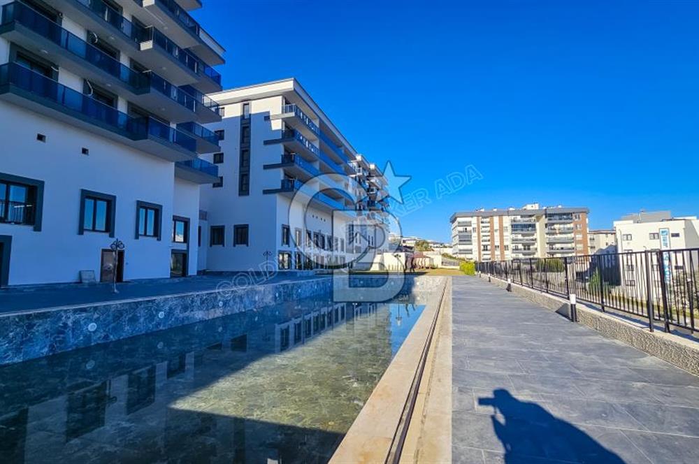 Kuşadası İkiçeşmelik te havuzlu sitede satılık 2+1 daire