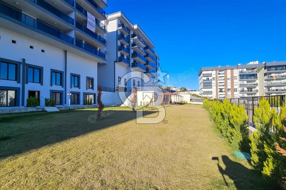 Kuşadası İkiçeşmelik te havuzlu sitede satılık 2+1 daire