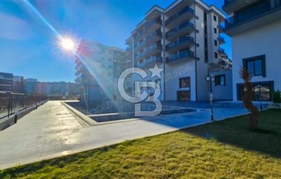 Kuşadası İkiçeşmelik te havuzlu sitede satılık 2+1 daire