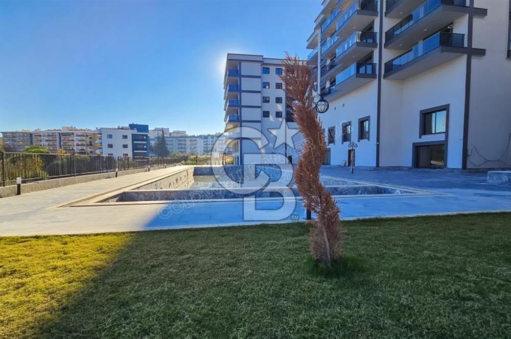 Kuşadası İkiçeşmelik te havuzlu sitede satılık 2+1 daire
