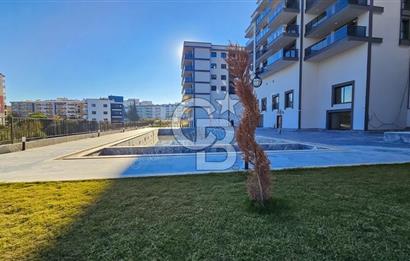 Kuşadası İkiçeşmelik te havuzlu sitede satılık 2+1 daire