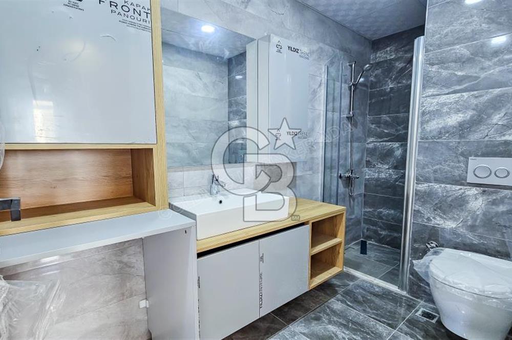 Kuşadası İkiçeşmelik te havuzlu sitede satılık 2+1 daire