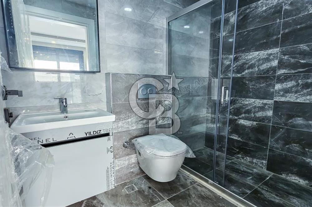 Kuşadası İkiçeşmelik te havuzlu sitede satılık 2+1 daire
