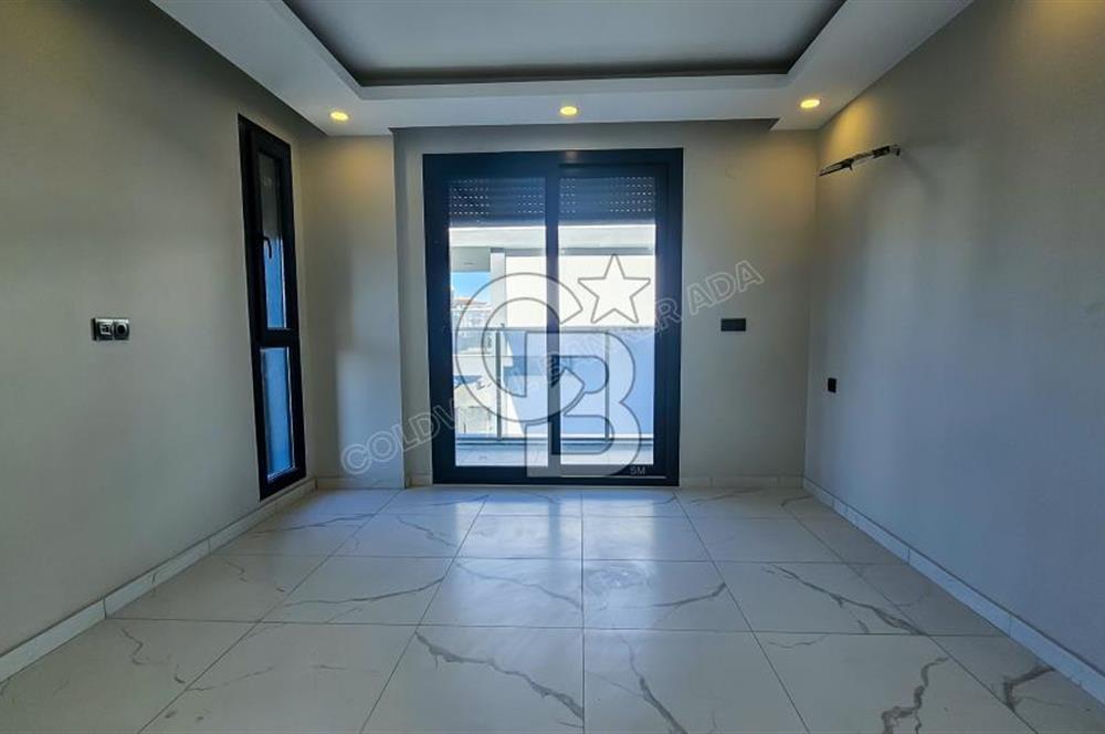 Kuşadası İkiçeşmelik te havuzlu sitede satılık 2+1 daire