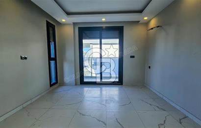 Kuşadası İkiçeşmelik te havuzlu sitede satılık 2+1 daire