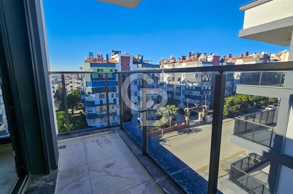 Kuşadası İkiçeşmelik te havuzlu sitede satılık 2+1 daire