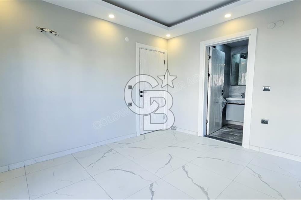 Kuşadası İkiçeşmelik te havuzlu sitede satılık 2+1 daire