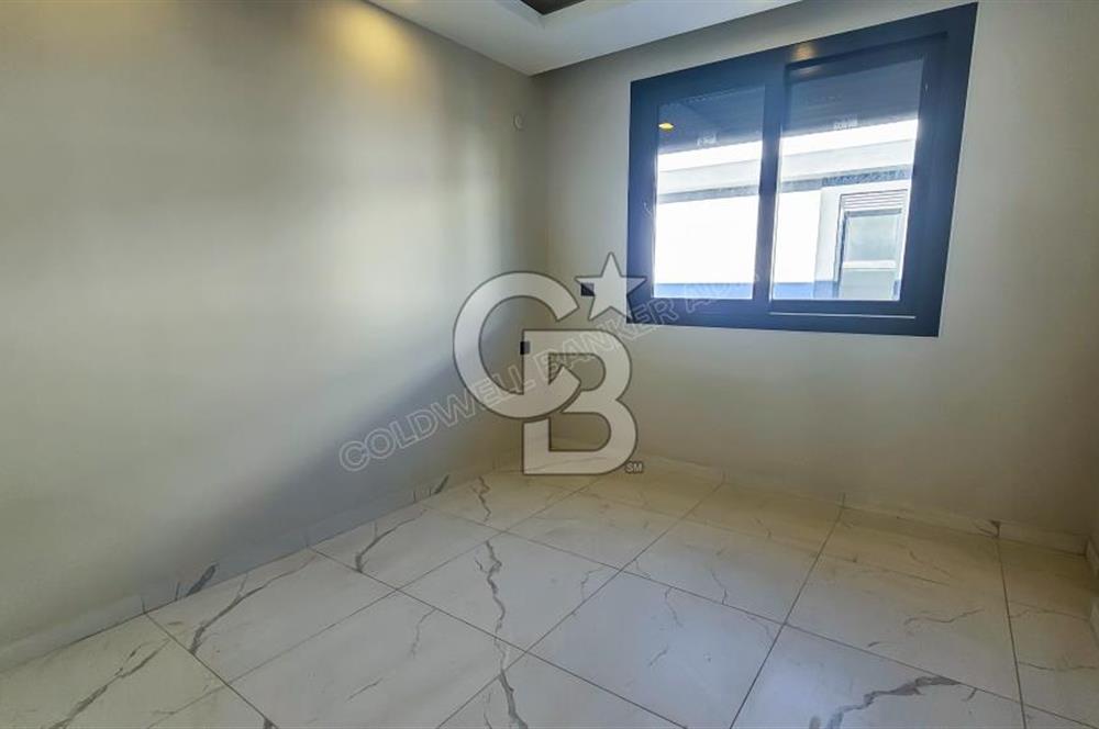 Kuşadası İkiçeşmelik te havuzlu sitede satılık 2+1 daire