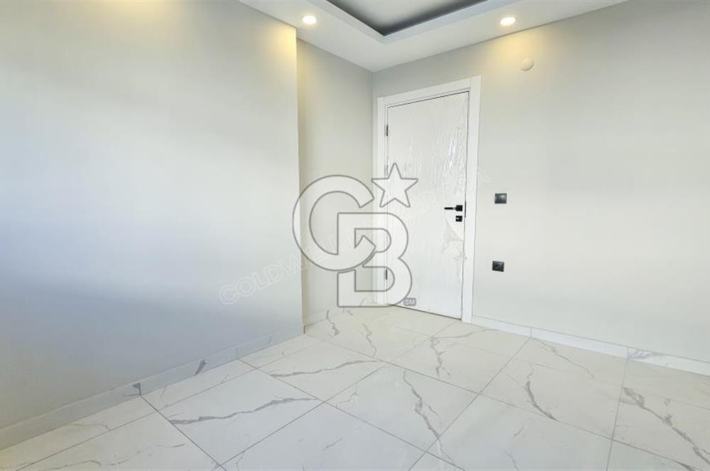 Kuşadası İkiçeşmelik te havuzlu sitede satılık 2+1 daire