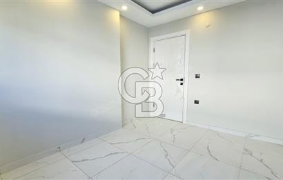 Kuşadası İkiçeşmelik te havuzlu sitede satılık 2+1 daire