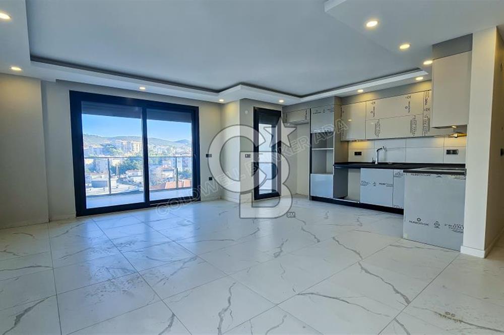 Kuşadası İkiçeşmelik te havuzlu sitede satılık 2+1 daire