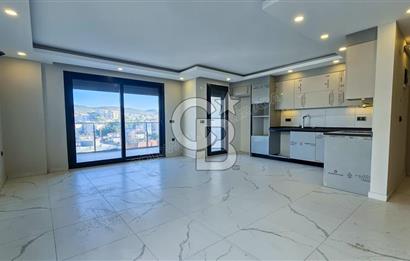 Kuşadası İkiçeşmelik te havuzlu sitede satılık 2+1 daire