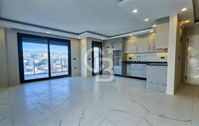 Kuşadası İkiçeşmelik te havuzlu sitede satılık 2+1 daire