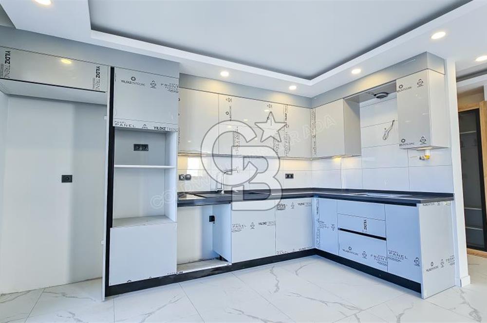 Kuşadası İkiçeşmelik te havuzlu sitede satılık 2+1 daire