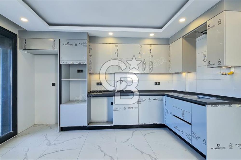 Kuşadası İkiçeşmelik te havuzlu sitede satılık 2+1 daire