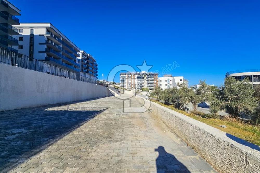 Kuşadası İkiçeşmelik te havuzlu sitede satılık 2+1 daire