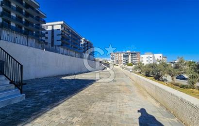 Kuşadası İkiçeşmelik te havuzlu sitede satılık 2+1 daire