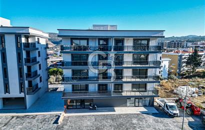 Kuşadası İkiçeşmelik te havuzlu sitede satılık 2+1 daire