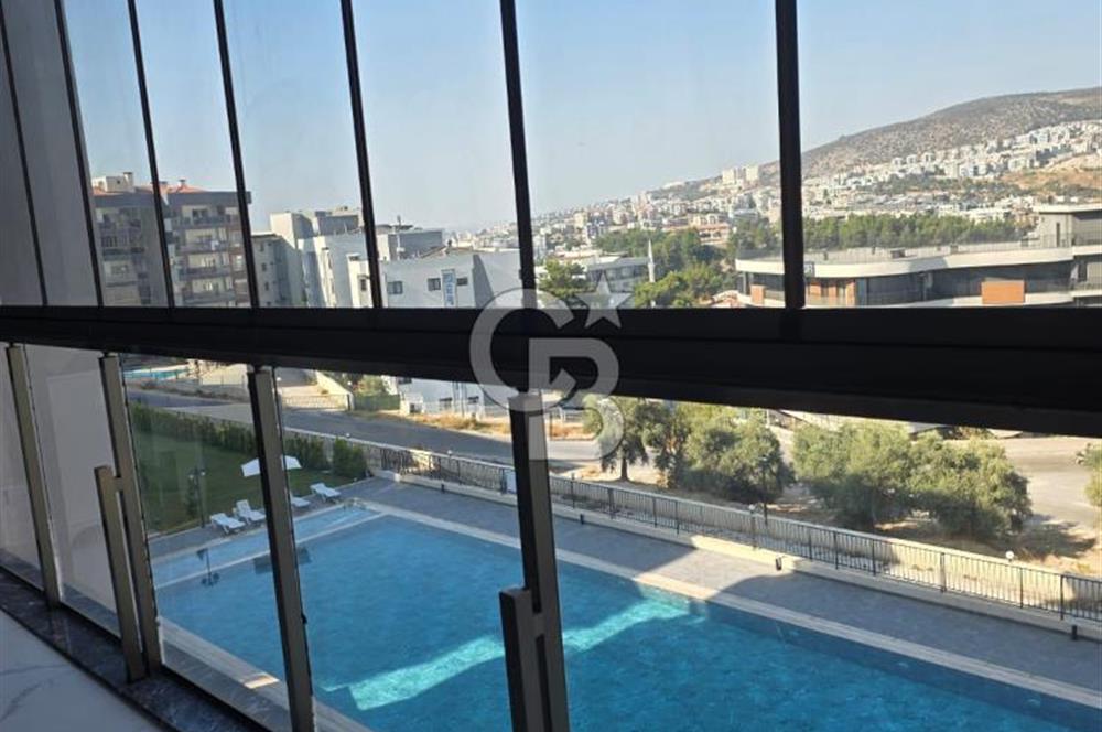 Kuşadası İkiçeşmelik te havuzlu sitede satılık 2+1 daire