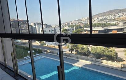Kuşadası İkiçeşmelik te havuzlu sitede satılık 2+1 daire