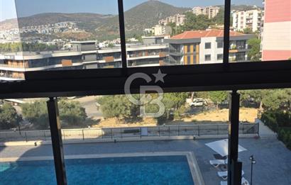 Kuşadası İkiçeşmelik te havuzlu sitede satılık 2+1 daire