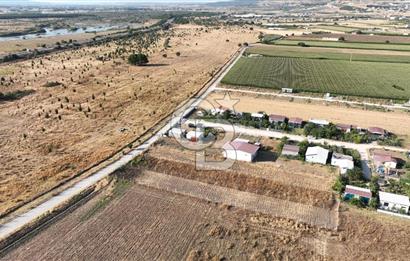 KUŞADASI ANAYOLUNA YAKIN 980 m² ETRAFI ÇEVRİLİ HİSSELİ TAPU