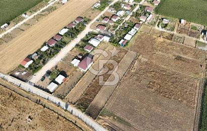 KUŞADASI ANAYOLUNA YAKIN 980 m² ETRAFI ÇEVRİLİ HİSSELİ TAPU