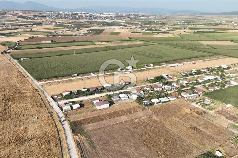 KUŞADASI ANAYOLUNA YAKIN 980 m² ETRAFI ÇEVRİLİ HİSSELİ TAPU