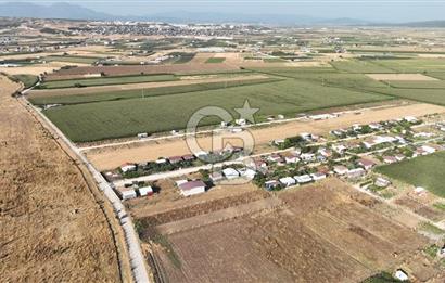 KUŞADASI ANAYOLUNA YAKIN 980 m² ETRAFI ÇEVRİLİ HİSSELİ TAPU