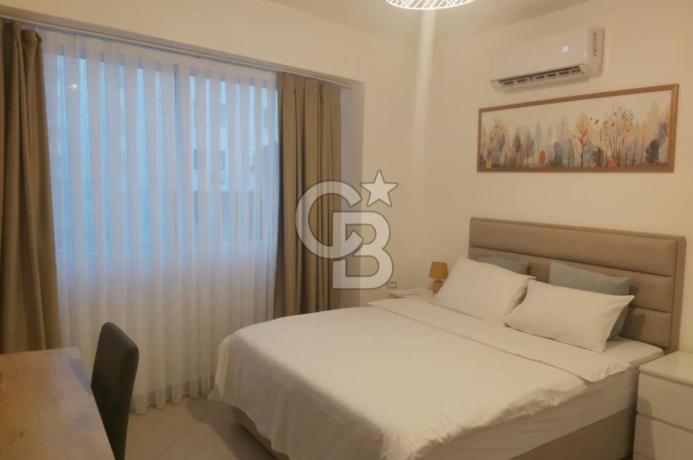 KKTC GİRNE MERKEZDE LES AMBASSADEURS HOTELE VE DENİZE YAKIN SATILIK 1+1 EŞYALI DAİRE