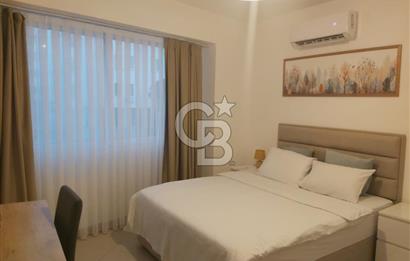 KKTC GİRNE MERKEZDE LES AMBASSADEURS HOTELE VE DENİZE YAKIN SATILIK 1+1 EŞYALI DAİRE