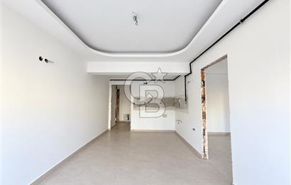 KARŞIYAKA MAVİŞEHİR YALI MAHALLESİNDE BAHÇELİ 1+1  SATILIK DAİRE