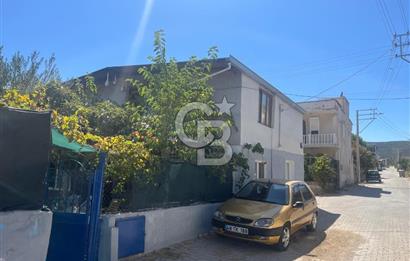 URLA GÜLBAHÇE'DE İÇERİSİNDE KAYITLI BİNA OLAN İMARLI ARSA