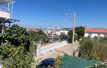 URLA GÜLBAHÇE'DE İÇERİSİNDE KAYITLI BİNA OLAN İMARLI ARSA