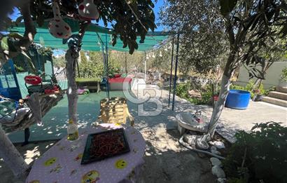 URLA GÜLBAHÇE'DE İÇERİSİNDE KAYITLI BİNA OLAN İMARLI ARSA