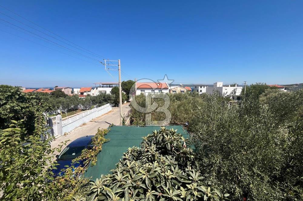 URLA GÜLBAHÇE'DE İÇERİSİNDE KAYITLI BİNA OLAN İMARLI ARSA