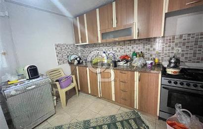 URLA GÜLBAHÇE'DE İÇERİSİNDE KAYITLI BİNA OLAN İMARLI ARSA