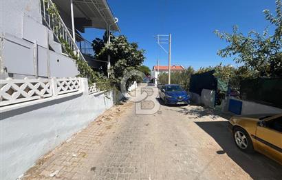 URLA GÜLBAHÇE'DE İÇERİSİNDE KAYITLI BİNA OLAN İMARLI ARSA
