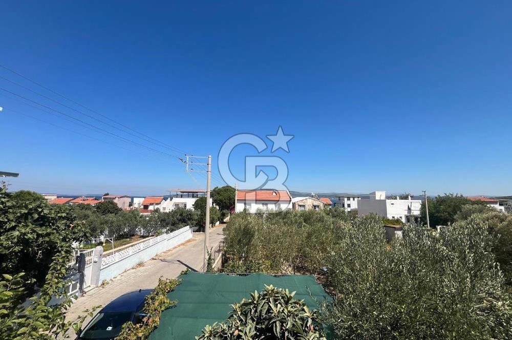 URLA GÜLBAHÇE'DE İÇERİSİNDE KAYITLI BİNA OLAN İMARLI ARSA