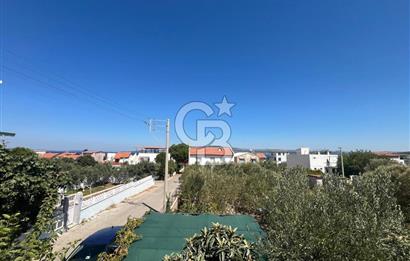 URLA GÜLBAHÇE'DE İÇERİSİNDE KAYITLI BİNA OLAN İMARLI ARSA