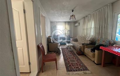 URLA GÜLBAHÇE'DE İÇERİSİNDE KAYITLI BİNA OLAN İMARLI ARSA
