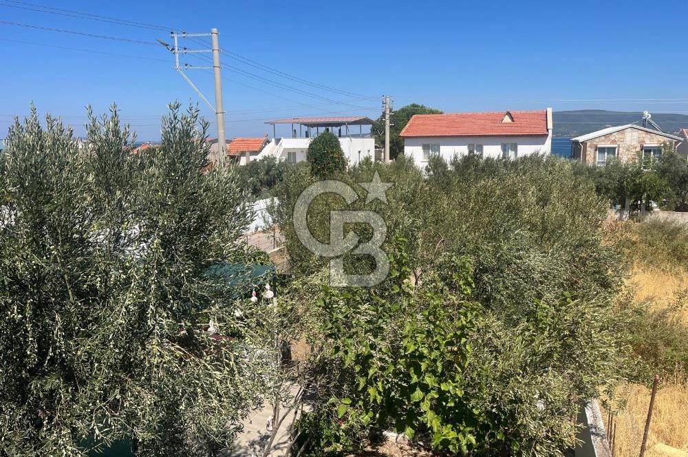 URLA GÜLBAHÇE'DE İÇERİSİNDE KAYITLI BİNA OLAN İMARLI ARSA