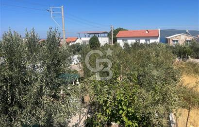 URLA GÜLBAHÇE'DE İÇERİSİNDE KAYITLI BİNA OLAN İMARLI ARSA