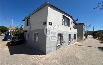 URLA GÜLBAHÇE'DE İÇERİSİNDE KAYITLI BİNA OLAN İMARLI ARSA
