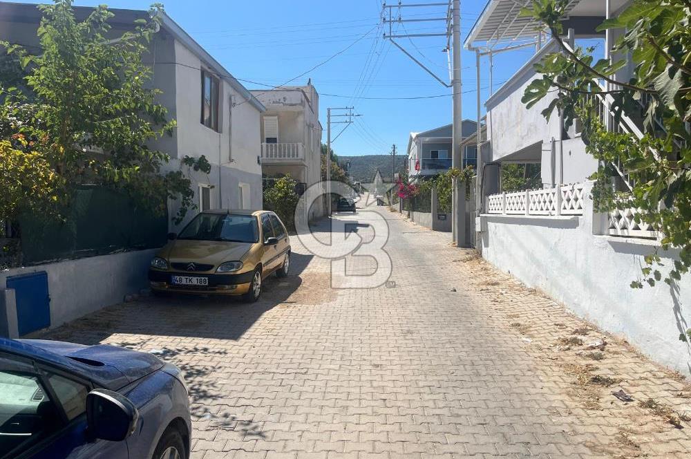 URLA GÜLBAHÇE'DE İÇERİSİNDE KAYITLI BİNA OLAN İMARLI ARSA