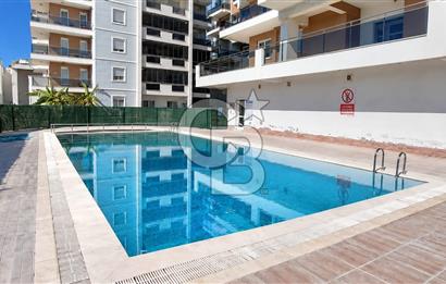 ÇİĞLİ HARMANDALI'NDA HAVUZLU SİTE İÇERİSİNDE FERAH VE KULLANIŞLI 2+1 DAİRE